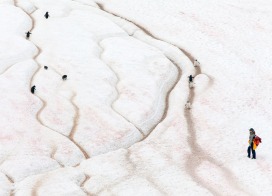 A visitor next to a «Penguin Highway» at Neko Harbour (Antarctic Peninsula)
